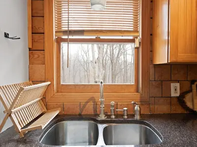 a sink in a kitchen with a window at 5 min to Lake Chic Cozy Hot Tub in Sparta
