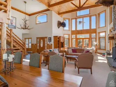 a large living room with a table and chairs at Fireplaces, Home Theater, Ski-In Out Windham Lodge in Windham