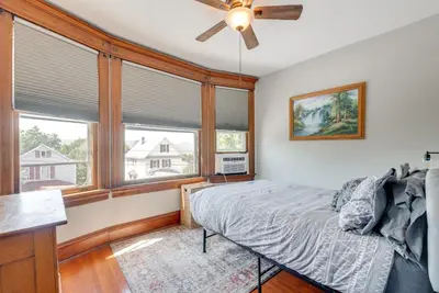 a bedroom with a bed and a ceiling fan at 6 Mi to Montage Mtn Resort! Family Home with Yard in Scranton