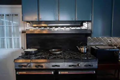 a kitchen with a stove with two pots on it at The Pulpit House