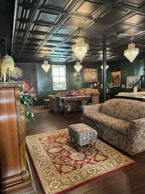 a living room with a couch and a table at The Pulpit House