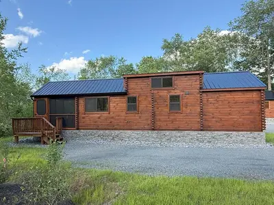 a log cabin with a solarium on top of it at Tiny Cabin #4 by Windham NY Escape 'Cabin Comfort' in Hensonville