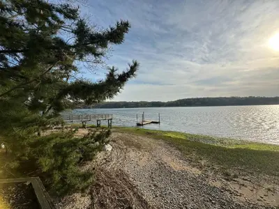 a dock on the shore of a lake at Waterfront Paradise in St James in Nissequogue