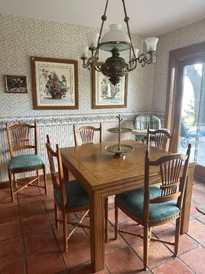 a dining room with a wooden table and chairs at Waterfront Paradise in St James in Nissequogue