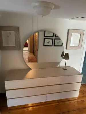 a room with a dresser with a mirror on it at Historic Home near Stony Brook Village & Beach in Stony Brook
