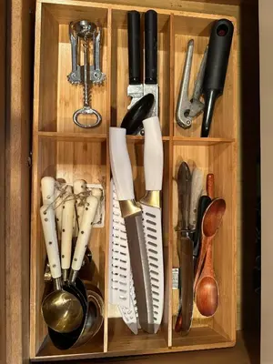 a wooden drawer filled with kitchen utensils at Historic Home near Stony Brook Village & Beach in Stony Brook