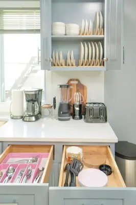 a kitchen with a counter with dishes and utensils at Sky Walk at The Hillside in Newark