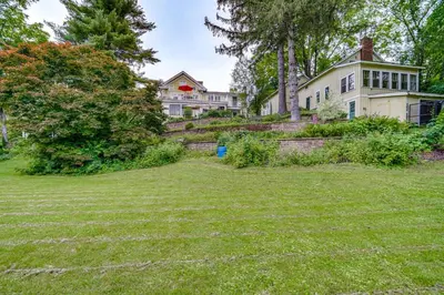 an empty yard in front of a house at Steps to Downtown Stockbridge Home with Patio! in Stockbridge