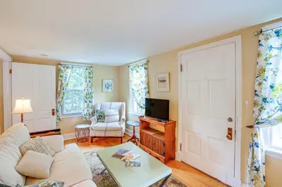 a living room with a couch and a tv at 2 Mi to Norman Rockwell Museum Stockbridge Apt! in Stockbridge