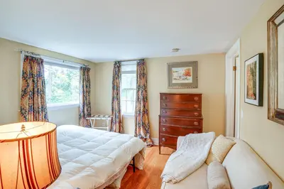 a living room with a couch and a dresser at 2 Mi to Norman Rockwell Museum Stockbridge Apt! in Stockbridge