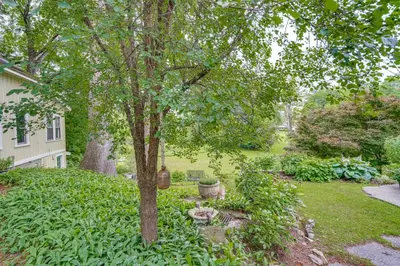 a yard with a tree and a house at 2 Mi to Norman Rockwell Museum Stockbridge Apt! in Stockbridge
