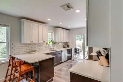 a kitchen with white cabinets and a counter top at Family Home with Outdoor Oasis in Hudson Valley in High Falls