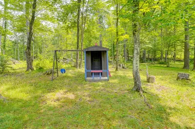 a small shack in the middle of a forest at Family Home with Outdoor Oasis in Hudson Valley in High Falls