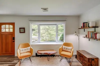 two chairs and a table in a room with a window at Family Home with Outdoor Oasis in Hudson Valley in High Falls