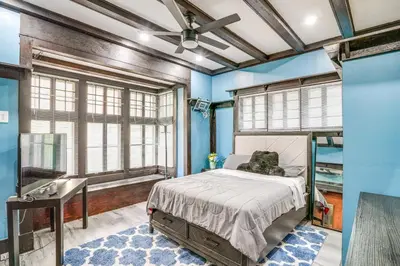 a bedroom with a bed and a sink and a tub at Steps to Union College Home with Shared Yard! in Schenectady