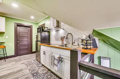 a kitchen with a sink and a counter top at Walk to Nott Memorial Studious Retreat Near Eats in Schenectady