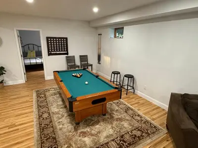 a living room with a pool table in it at Mountain Modern Escape - EV Charger - 5BDRM in Hensonville