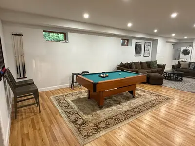 a living room with a pool table in it at Mountain Modern Escape - EV Charger - 5BDRM in Hensonville