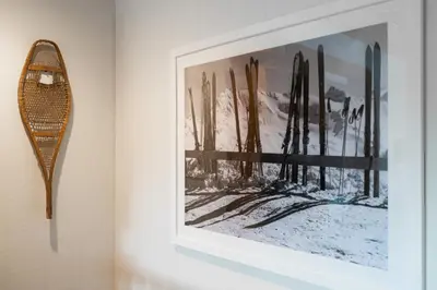 a framed picture of skis on a wall at MtSnow , HotTub, Pool, Air Hockey,Ping Pong, Darts in Wilmington