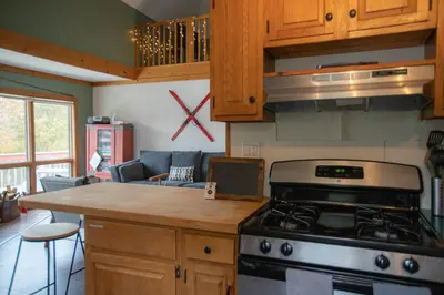 a kitchen with a stove and a counter top at MtSnow , HotTub, Pool, Air Hockey,Ping Pong, Darts in Wilmington