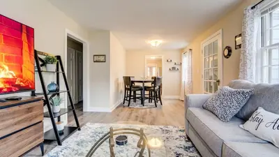 a living room with a couch and a table at Family Retreat Near Yale - Stylish Free Wifi in New Haven