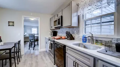 a kitchen with a sink and a counter top at Family Retreat Near Yale - Stylish Free Wifi in New Haven