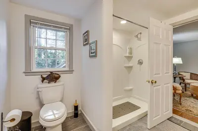 a bathroom with a toilet and a walk in shower at Family Getaway in Bristol Near Trails and Parks! in Bristol