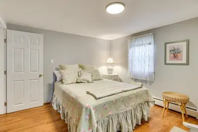 a white bedroom with a bed and a window at Family Getaway in Bristol Near Trails and Parks! in Bristol