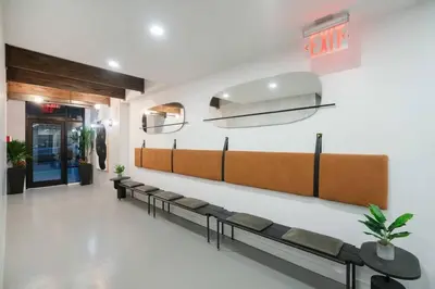 a waiting room with benches in a hospital at Top Notch 2BR & 2BA Suite Minutes to Central Park in New York
