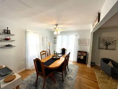 a dining room with a table and chairs at Dog-Friendly Oceanfront Getaway - Walk to Dining - Private Beach Access in Milford