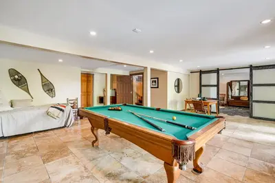 a living room with a pool table in it at Riverfront Hudson Valley Gem with Beach Access! in Athens