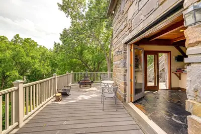 a wooden deck with a table and chairs on it at Riverfront Hudson Valley Gem with Beach Access! in Athens