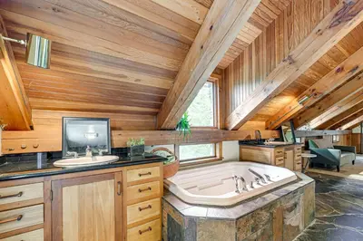 a large bathroom with a tub and a sink at Riverfront Hudson Valley Gem with Beach Access! in Athens