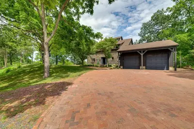 a brick driveway in front of a house at Riverfront Hudson Valley Gem with Beach Access! in Athens