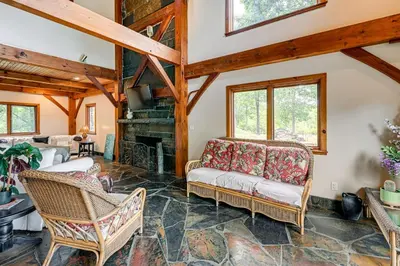 a living room with a couch and a fireplace at Riverfront Hudson Valley Gem with Beach Access! in Athens