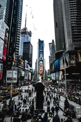 a crowd of people walking in a busy city at Heavenly Stays in New York