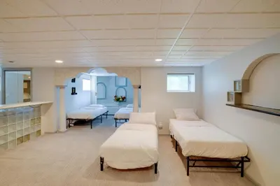 a hospital room with four beds in it at Pool Table and Deck Luxury Mansion in Niskayuna! in Niskayuna