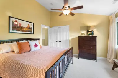 a bedroom with a bed and a ceiling fan at Escape to Mountainview Haven Spacious Retreat with Hot Tub at Mount Snow in West Dover