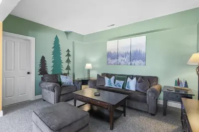 a living room with two couches and a table at Escape to Mountainview Haven Spacious Retreat with Hot Tub at Mount Snow in West Dover