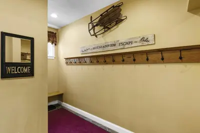 a hallway with a welcome sign on the wall at Escape to Mountainview Haven Spacious Retreat with Hot Tub at Mount Snow in West Dover