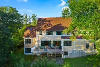 an aerial view of a house with a deck at Escape to Mountainview Haven Spacious Retreat with Hot Tub at Mount Snow in West Dover