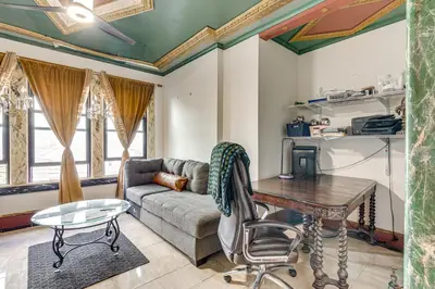 a living room with a couch and a table at Near Downtown Scranton Getaway with Patio in Scranton