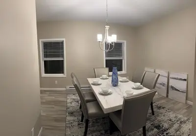a dining room with a table and chairs at Escape to Luxury in the Poconos Your Year-Round Family Retreat in Daleville