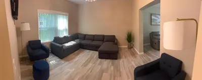 a living room with a couch and two chairs at Escape to Luxury in the Poconos Your Year-Round Family Retreat in Daleville