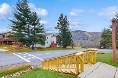 a wooden fence on the side of a road at 5B Mountain Village- Unit B in Dover