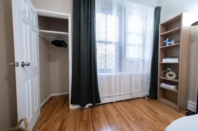a room with a door and a window at Sunlit 2BR Central Park North elevator & laundry in New York