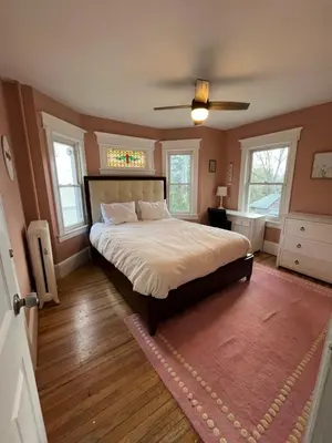 a bedroom with a bed and a ceiling fan at Grand Bergen Home Near NYC-Shops in Maywood