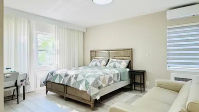 a bedroom with a bed and a couch at Line&Light