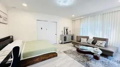 a bedroom with a bed and a couch at Line&Light