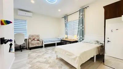 a bedroom with a bed and a chair at Line&Light